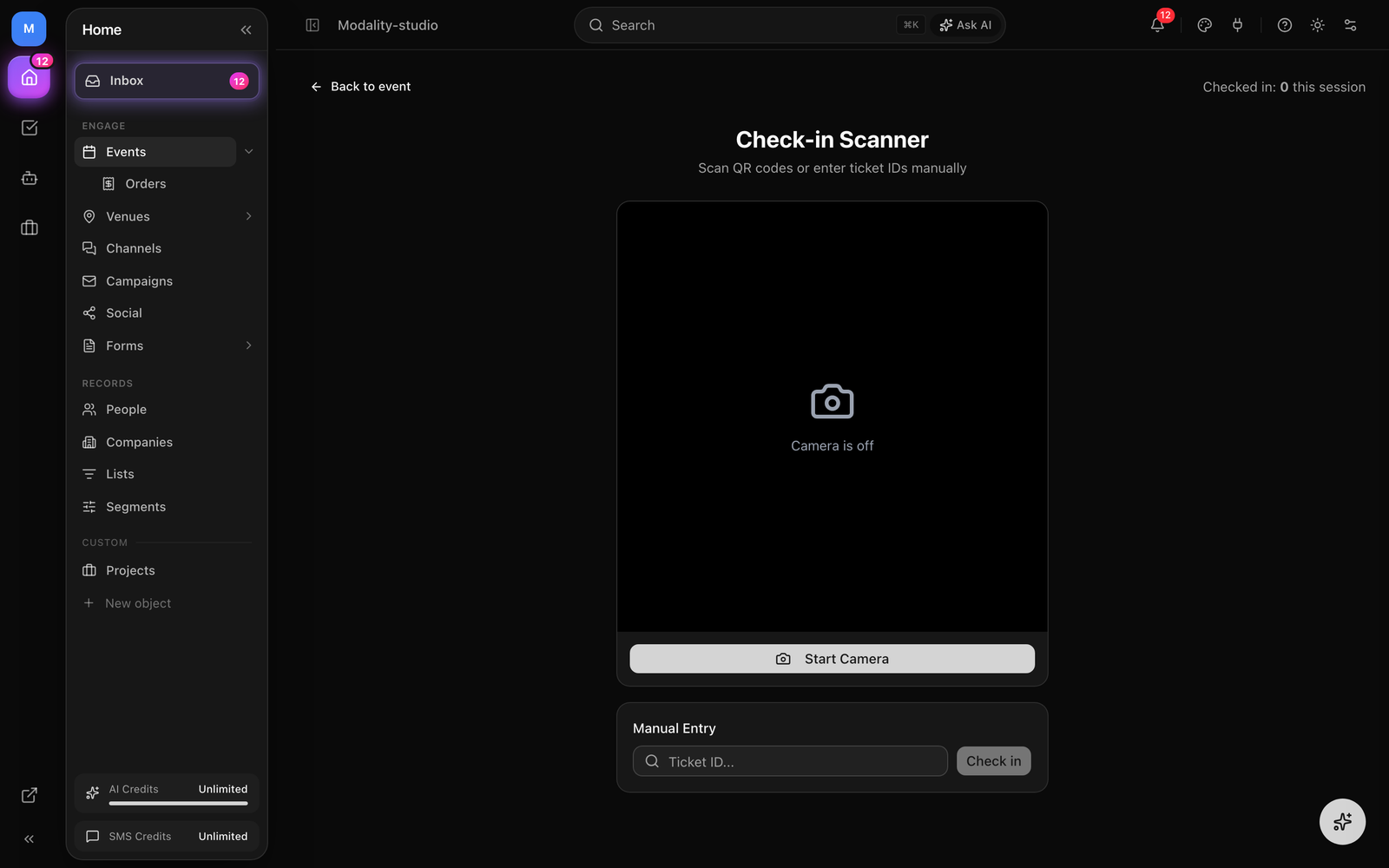 The dashboard check-in scanner (/events/[id]/check-in) with the live camera view, the manual ID lookup, a valid-scan result card, and the 'Checked in: N this session' counter.