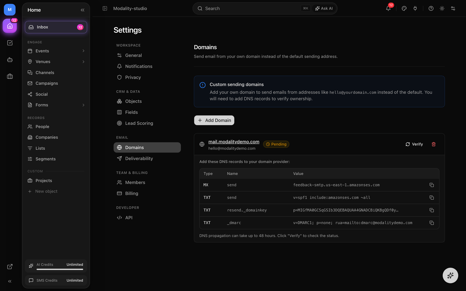 Settings → Domains showing an added domain with its DKIM, SPF/return-path, and DMARC records and their verification states.