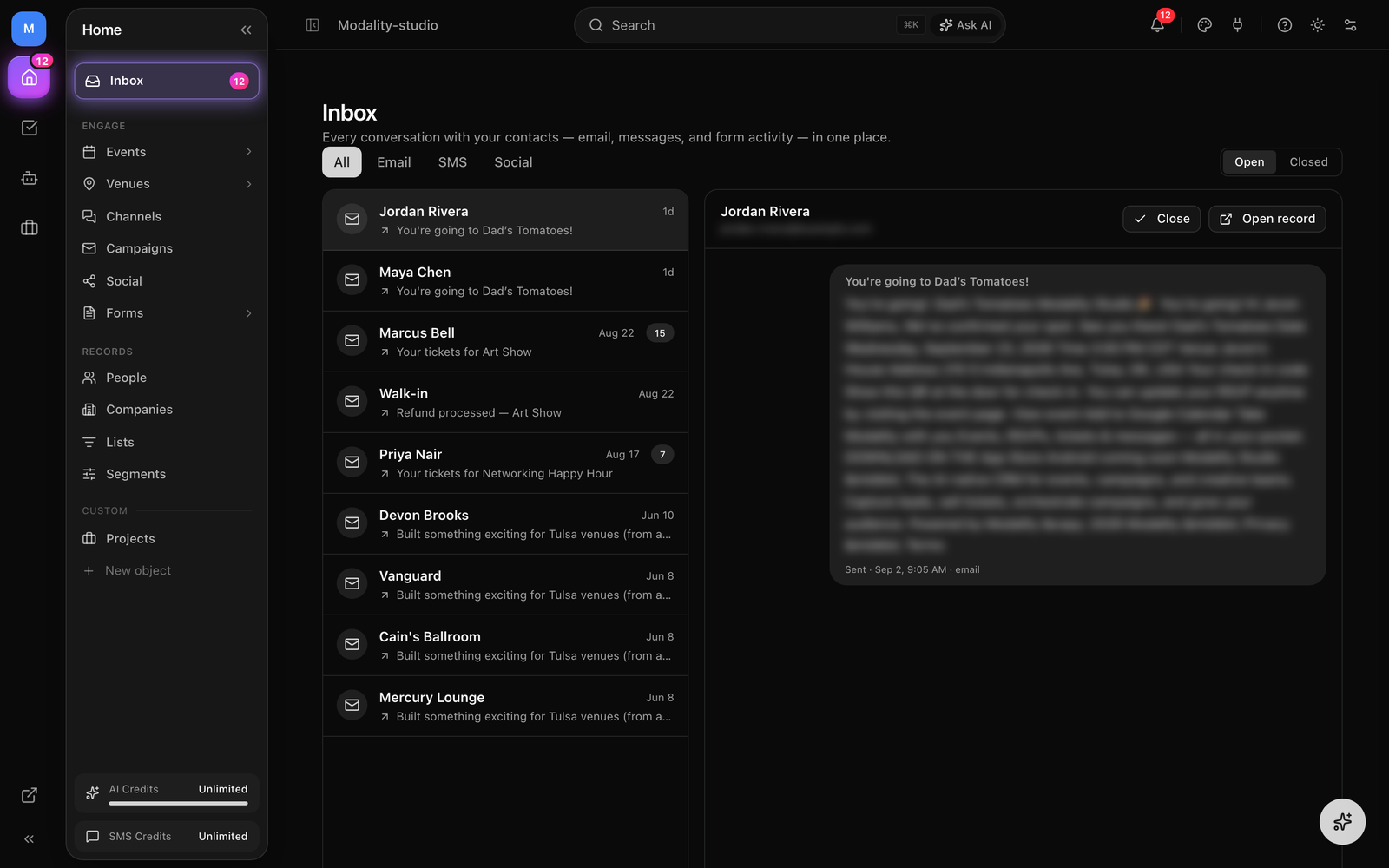 The Inbox, the All/Email/SMS/Social channel filter and Open/Closed toggle across the top, the thread list on the left (contact name, channel icon, direction arrow, preview, unread dot, count badge), and the selected conversation's message thread on the right.